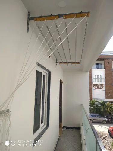 Balcony cloth drying hangers installed in Bangalore apartment for daily clothes drying